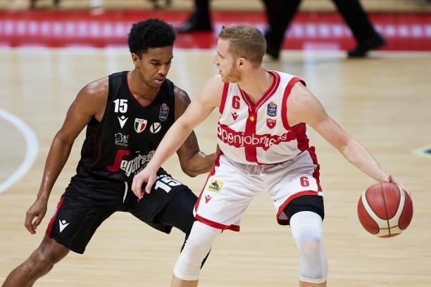 Andrea Amato of Openjobmetis Varese competes for the ball with Ty-Shon Alexander of Virtus Segafredo Bologna during the Lega Basket Serie A match...
