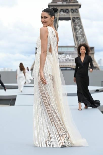 Rebecca Mir walks the runway during "Le Defile L'Oreal Paris 2021