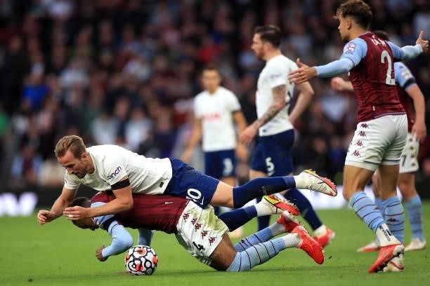 Harry Kane of Tottenham Hotspur and Ezri Konsa of Aston Villa tangle during the Premier League match between Tottenham Hotspur and Aston Villa at...