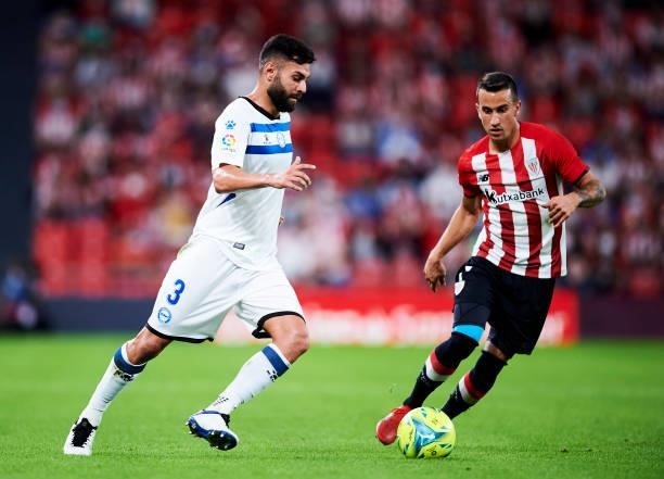 Ruben Duarte of Deportivo Alaves duels for the ball with Alejandro Berenguer of Athletic Club during the Laliga Santander match between Athletic Club...