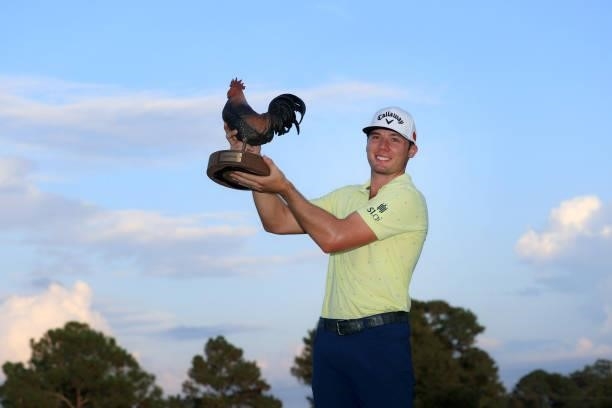 Sam Burns poses with the trophy after winning during the final round of the Sanderson Farms Championship at Country Club of Jackson on October 03,...