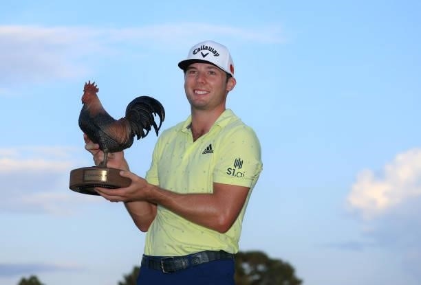 Sam Burns poses with the trophy after winning during the final round of the Sanderson Farms Championship at Country Club of Jackson on October 03,...