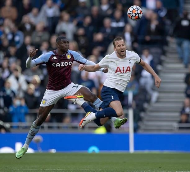Harry Kane of Tottenham Hotspur is fouled by Kortney Hause of Aston Villa during the Premier League match between Tottenham Hotspur and Aston Villa...