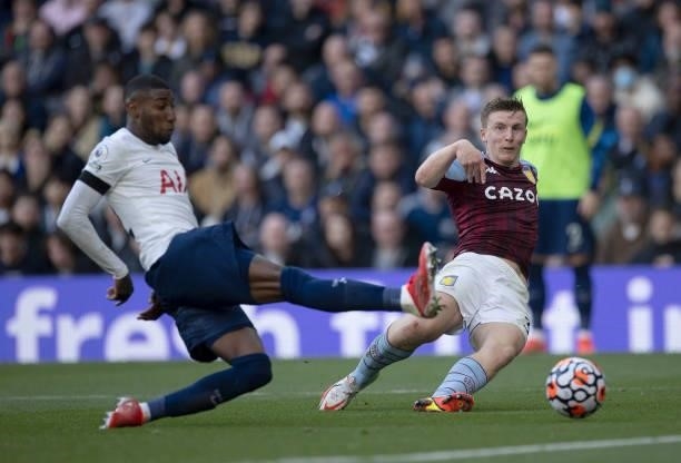 Matt Targett of Aston Villa is challenged by Emerson of Tottenham Hotspur during the Premier League match between Tottenham Hotspur and Aston Villa...