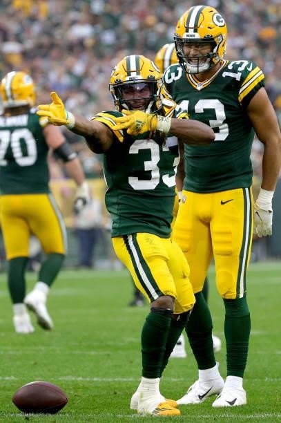 Aaron Jones of the Green Bay Packers celebrates a first down during the second half against the Pittsburgh Steelers at Lambeau Field on October 03,...