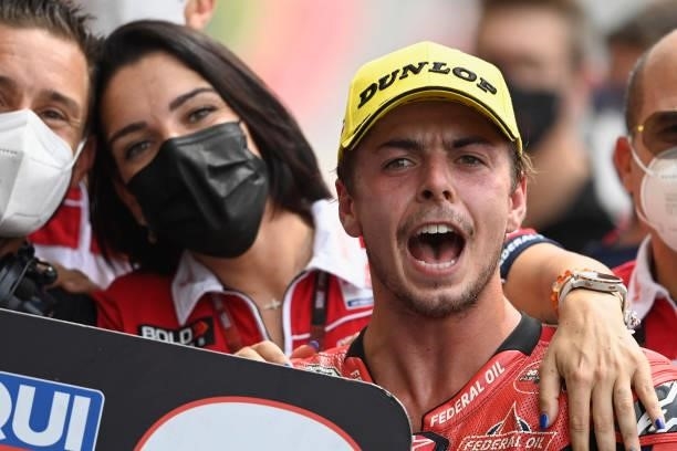 Fabio Di Giannantonio of Italy and Federal Oil Gresini Moto2 celebrates the second place under the podium with team during the Moto2 race during the...