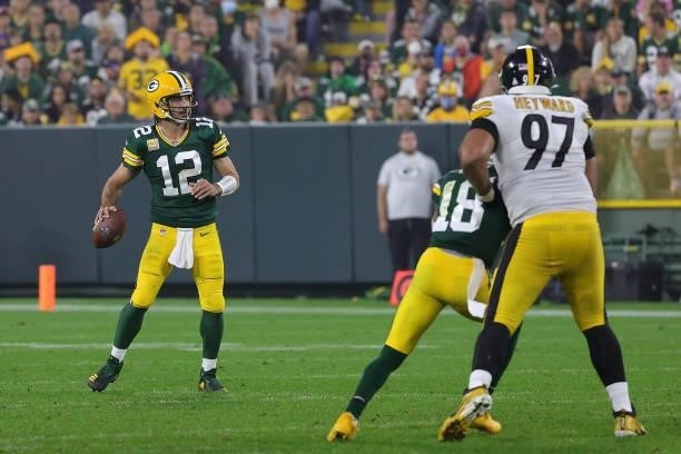 Aaron Rodgers of the Green Bay Packers looks to pass during a game against the Pittsburgh Steelers at Lambeau Field on October 03, 2021 in Green Bay,...