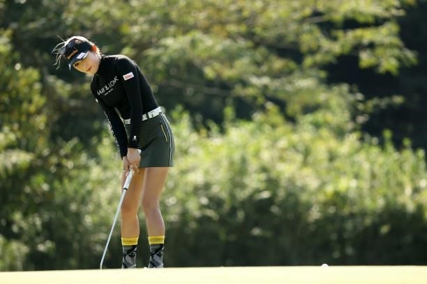 Kumiko Kaneda of Japan attempts a putt on the 5th green during the final round of the 54th Japan Women's Open Golf Championship at Karasuyamajo...