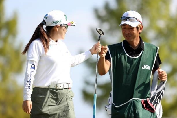 Minami Katsu of Japan fist bumps after the birdie on the 7th green during the final round of the 54th Japan Women's Open Golf Championship at...