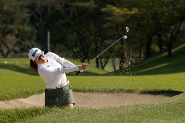 Minami Katsu of Japan hits out from a bunker on the 8th hole during the final round of the 54th Japan Women's Open Golf Championship at Karasuyamajo...
