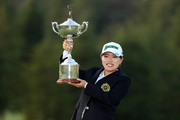Minami Katsu poses with the trophy after winning the tournament following the final round of the 54th Japan Women's Open Golf Championship at...