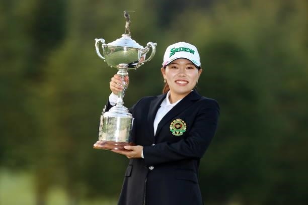 Minami Katsu poses with the trophy after winning the tournament following the final round of the 54th Japan Women's Open Golf Championship at...