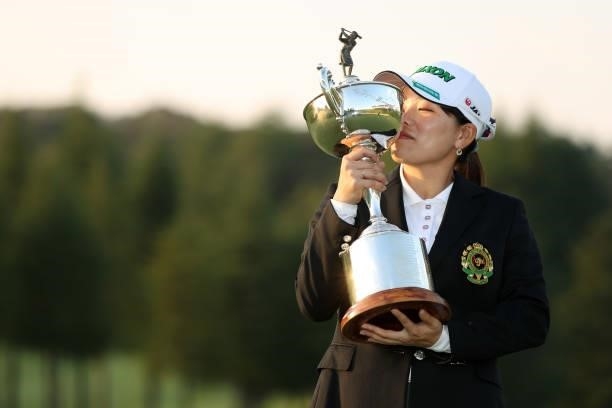Minami Katsu of Japan kisses the trophy after winning the tournament following the final round of the 54th Japan Women's Open Golf Championship at...