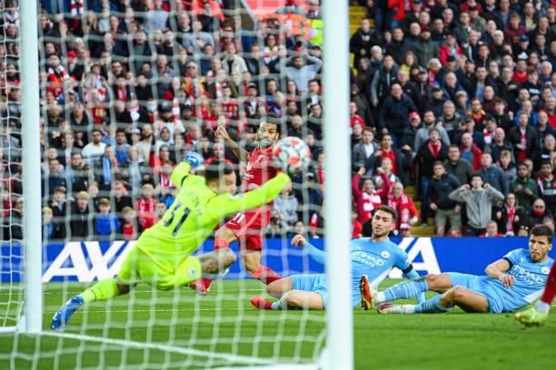 Mohamed Salah of Liverpool scores to make it 2-1 during the Premier League match between Liverpool and Manchester City at Anfield on October 03, 2021...