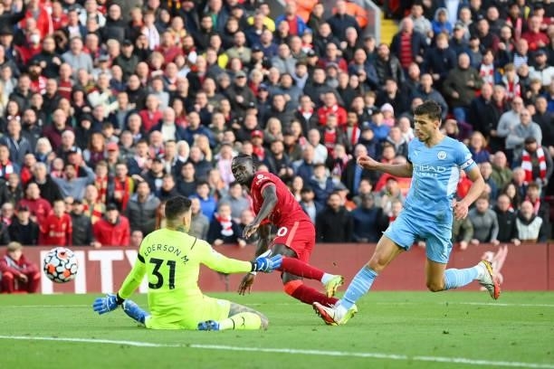 Saido Mane of Liverpool scores the first goal during the Premier League match between Liverpool and Manchester City at Anfield on October 03, 2021 in...