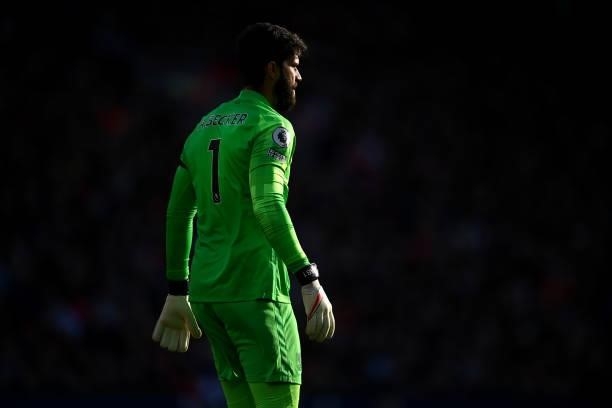 Alisson Becker of Liverpool looks on during the Premier League match between Liverpool and Manchester City at Anfield on October 03, 2021 in...