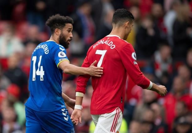 Cristiano Ronaldo of Manchester United walks straight off the pitch followed by Andros Townsend of Everton after the Premier League match between...
