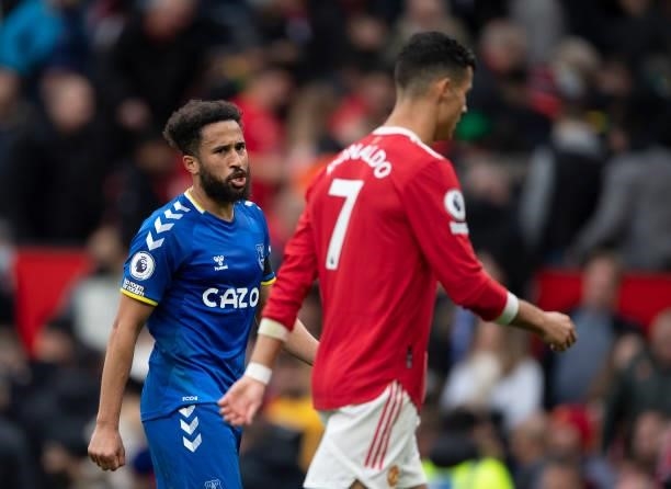 Cristiano Ronaldo of Manchester United walks straight off the pitch followed by Andros Townsend of Everton after the Premier League match between...