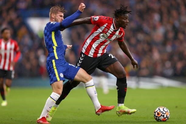 Mohammed Salisu of Southampton holds off Timo Werner of Chelsea during the Premier League match between Chelsea and Southampton at Stamford Bridge on...