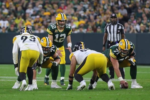 Aaron Rodgers of the Green Bay Packers waits for the snap during a game against the Pittsburgh Steelers at Lambeau Field on October 03, 2021 in Green...