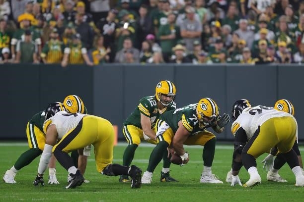 Aaron Rodgers of the Green Bay Packers waits for the snap during a game against the Pittsburgh Steelers at Lambeau Field on October 03, 2021 in Green...