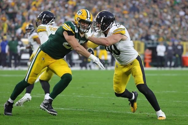 Watt of the Pittsburgh Steelers is blocked by Robert Tonyan of the Green Bay Packers during a game at Lambeau Field on October 03, 2021 in Green Bay,...