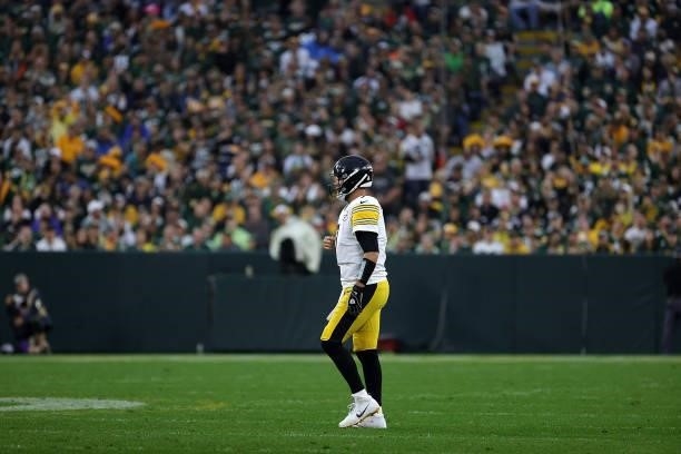 Ben Roethlisberger of the Pittsburgh Steelers walks to the huddle during a game against the Green Bay Packers at Lambeau Field on October 03, 2021 in...