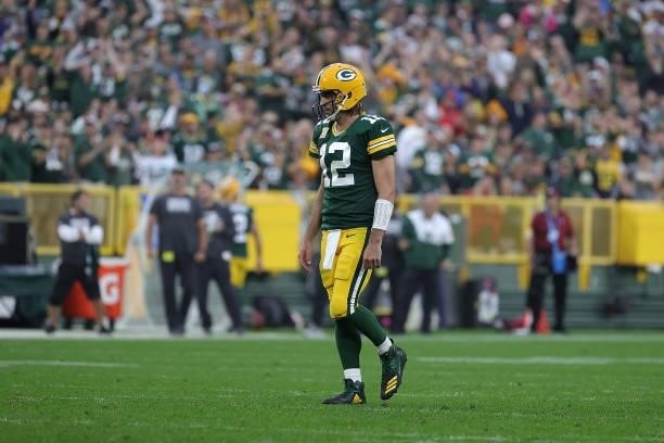 Aaron Rodgers of the Green Bay Packers walks to the huddle during a game against the Pittsburgh Steelers at Lambeau Field on October 03, 2021 in...