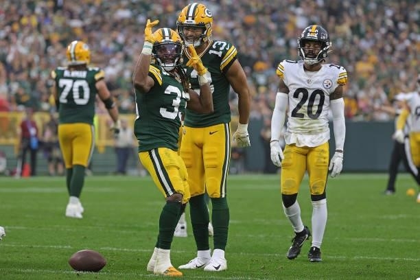 Aaron Jones of the Green Bay Packers celebrates a first down during a game against the Pittsburgh Steelers at Lambeau Field on October 03, 2021 in...