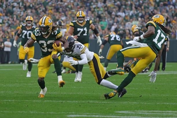 Aaron Jones of the Green Bay Packers runs for yards during a game against the Pittsburgh Steelers at Lambeau Field on October 03, 2021 in Green Bay,...