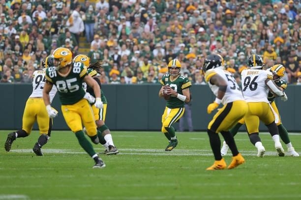 Aaron Rodgers of the Green Bay Packers drops back to pass during a game against the Pittsburgh Steelers at Lambeau Field on October 03, 2021 in Green...
