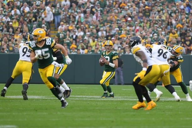 Aaron Rodgers of the Green Bay Packers drops back to pass during a game against the Pittsburgh Steelers at Lambeau Field on October 03, 2021 in Green...