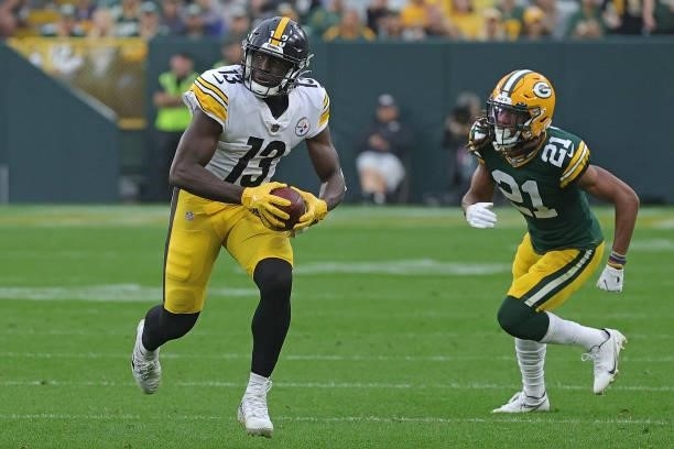 James Washington of the Pittsburgh Steelers runs for yards after a catch during a game against the Green Bay Packers at Lambeau Field on October 03,...