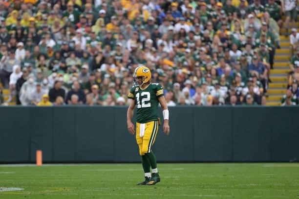 Aaron Rodgers of the Green Bay Packers walks to the huddle during a game against the Pittsburgh Steelers at Lambeau Field on October 03, 2021 in...