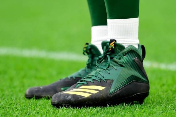 Detail view of the football cleats of Aaron Rodgers of the Green Bay Packers during pregame against the Pittsburgh Steelers at Lambeau Field on...