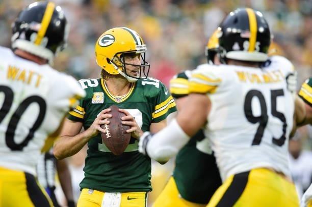 Aaron Rodgers of the Green Bay Packers looks to pass against the Pittsburgh Steelers in the second half at Lambeau Field on October 03, 2021 in Green...