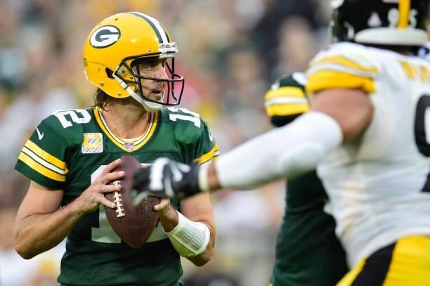 Aaron Rodgers of the Green Bay Packers looks to pass against the Pittsburgh Steelers in the second half at Lambeau Field on October 03, 2021 in Green...