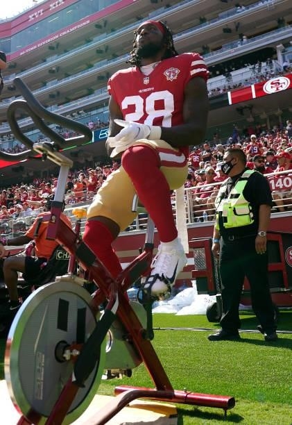Trey Sermon of the San Francisco 49ers rides a stationary bike on the sidelines before the game against the Seattle Seahawks at Levi's Stadium on...