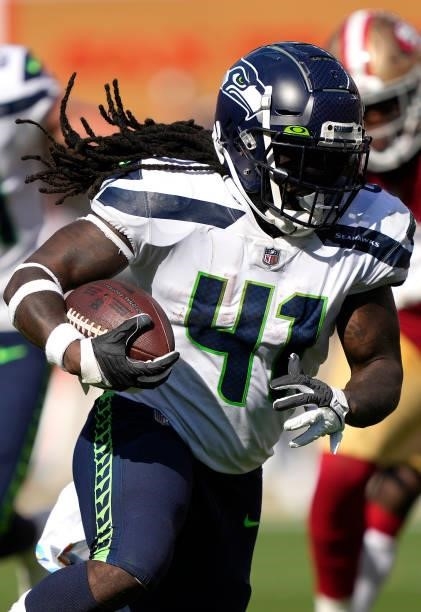 Alex Collins of the Seattle Seahawks runs the ball for a touchdown during the fourth quarter against the San Francisco 49ers at Levi's Stadium on...
