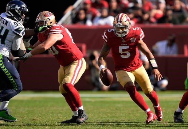 Trey Lance of the San Francisco 49ers scrambles with the ball during the fourth quarter against the Seattle Seahawks at Levi's Stadium on October 03,...