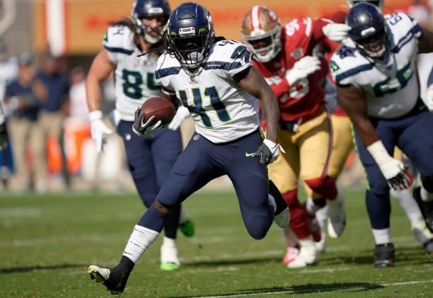 Alex Collins of the Seattle Seahawks runs the ball for a touchdown during the fourth quarter against the San Francisco 49ers at Levi's Stadium on...