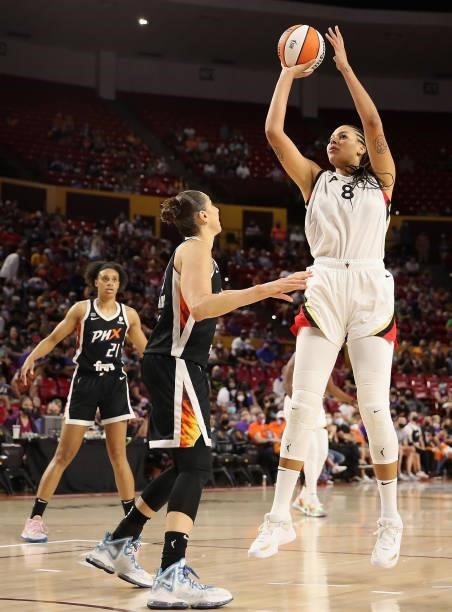 Liz Cambage of the Las Vegas Aces attempts a shot over Diana Taurasi of the Phoenix Mercury during Game Three of the 2021 WNBA semifinals at Desert...