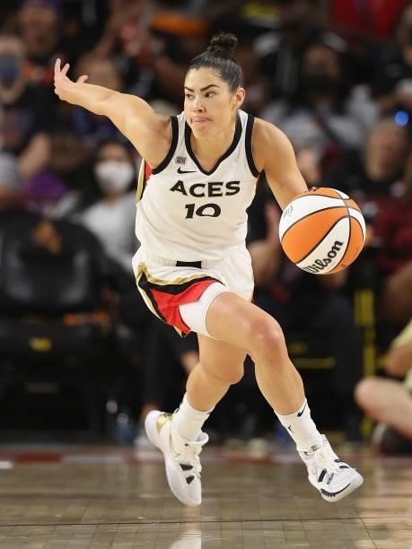 Kelsey Plum of the Las Vegas Aces handles the ball during Game Three of the 2021 WNBA semifinals at Desert Financial Arena on October 03, 2021 in...
