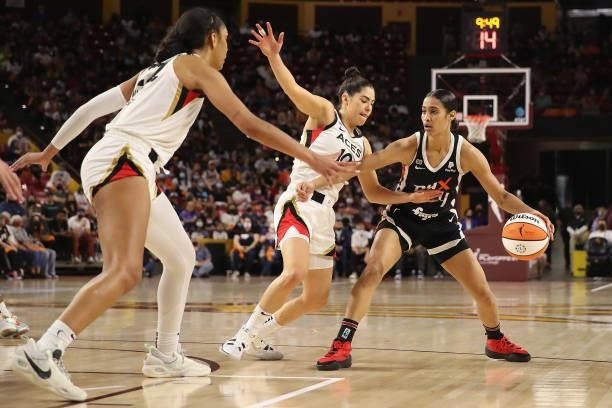 Skylar Diggins-Smith of the Phoenix Mercury handles the ball against Kelsey Plum of the Las Vegas Aces during Game Three of the 2021 WNBA semifinals...