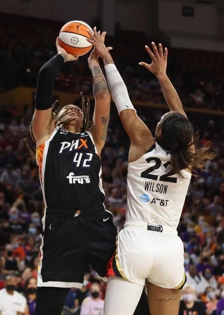 Brittney Griner of the Phoenix Mercury shoots over A'ja Wilson of the Las Vegas Aces during Game Three of the 2021 WNBA semifinals at Desert...