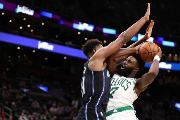Jaylen Brown of the Boston Celtics takes a shot against Gary Harris of the Orlando Magic during the second half of the preseason game at TD Garden on...