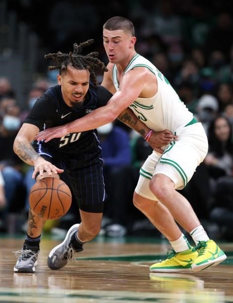 Payton Pritchard of the Boston Celtics defends Cole Anthony of the Orlando Magic during the second half of the preseason game at TD Garden on October...