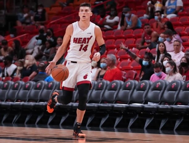 Tyler Herro of the Miami Heat dribbles the ball up the court against the Atlanta Hawks in the third quarter of preseason action at FTX Arena on...