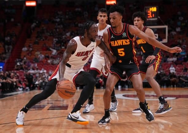 Marcus Garrett of the Miami Heat drives to the basket against the AJ Lawson of the Atlanta Hawks in the fourth quarter of a preseason game at FTX...