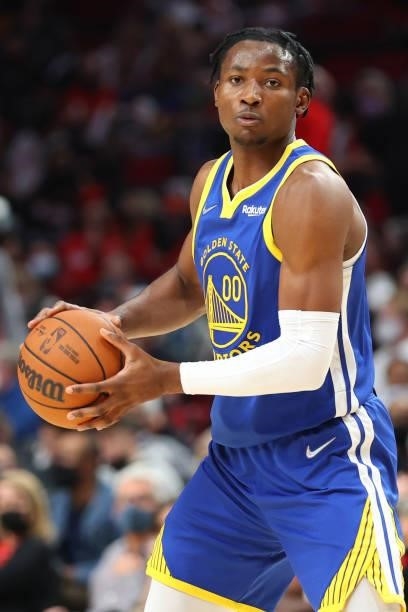 Jonathan Kuminga of the Golden State Warriors handles the ball in the fourth quarter against the Portland Trail Blazers during the preseason game at...